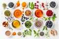 Top view of a diverse array of superfoods, nuts, seeds, and spices neatly arranged on a white background, perfect for a healthy Royalty Free Stock Photo