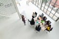 Top view of diverse people of creative team group using smartphone, mobile phone, tablet and computer laptop while meeting. Royalty Free Stock Photo