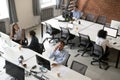 Top view of diverse workers busy working in shared office