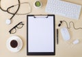 Top view of doctor desk table with stethoscope, clipboard, keyboard, microphone, cup of coffee, pills, glasses Royalty Free Stock Photo