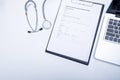 The top view of doctor desktop with stethoscope, clipboard with Royalty Free Stock Photo