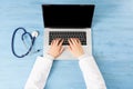 Top view of doctor hands typing at laptop Royalty Free Stock Photo