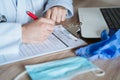 top view of a doctor man workspace. Doctor working on corona virus test. Covid-19 concept