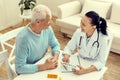 Top view of doctor and patient smiling while discussing treatment Royalty Free Stock Photo