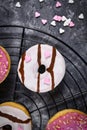 Top view of donut with white chocolate glazing and pink heart shaped sugar sprinkles Royalty Free Stock Photo