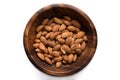 Top view dried almond in wood bowl on white background.