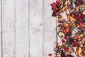 Top view of Dried flowers with Christmas lights on wooden table background. Free space for your text. Royalty Free Stock Photo