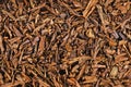 Top view of dried `Hojicha` tea leaves, a reddish brown roasted Japanese tea