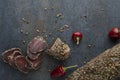 Top view of dried meat with red pepper on dark table Royalty Free Stock Photo