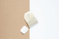 top view of dried tea bag placed on white paper and brown paper, copy space concept Royalty Free Stock Photo