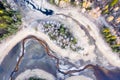 Top view of a dried-up river and cracks in the earth surrounded by trees Royalty Free Stock Photo