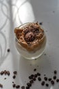 Top view of a drink with yummy chocolate pudding in a cupwith coffee beans on the side Royalty Free Stock Photo