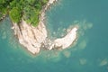 Top view drone shot of a stoney cliff of a coastline