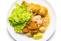 Top view of dry egg noodle topping with fried chicken drumstick, bean sprout, red pork, crispy wonton, lemon grass and vegetable Royalty Free Stock Photo