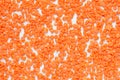 Top view of dry red lentils texture background