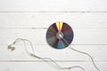 Top view of dvd disk and earphone Royalty Free Stock Photo
