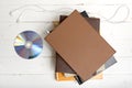 Top view of earphone with stack of book and dvd disc Royalty Free Stock Photo