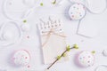 Top view Easter holiday composition of handcraft notebook with empty blank, branch with young shoots of greenery, cupcakes, heart