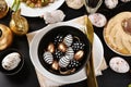 Top view of Easter table setting in black, white and golden colors Royalty Free Stock Photo