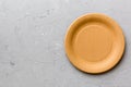Top view of eco paper plate on cement background. Empty space for your design Royalty Free Stock Photo