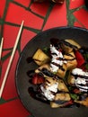 Top view of eggplants in a round gray plate