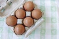 Top view of eggs in the carton on the table Royalty Free Stock Photo