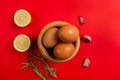 Top view of eggs, lemons and garlic ingredients needed to make the rich homemade alioli sauce typical Spanish sauce