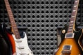 Top view of electric guitar on acoustic foam panel background Royalty Free Stock Photo