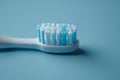 Top view of an electric toothbrush head lying flat on a surface, with a focus on the texture of the bristles.. AI Royalty Free Stock Photo