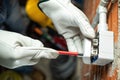 Electrician at work on a residential electrical system. Electricity Royalty Free Stock Photo