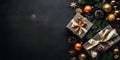 Top view of elegantly arranged gifts, baubles, pinecones, pine branches and Christmas trees on the right.Christmas banner with