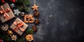 Top view of elegantly arranged gifts, gingerbread, pinecones, pine branches and Christmas trees on the left.Christmas banner with