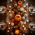 Top view of an elegantly set table, plates, cutlery, pumpkin candles, glasses. Pumpkin as a dish of thanksgiving for the harvest