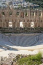 Top view of the elements of the Odeon of Herodes Atticus. View of the city through the arches of the ruins of the Acropol