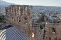 Top view of the elements of the Odeon of Herodes Atticus. View of the city through the arches of the ruins of the Acropol