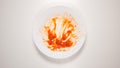 TOP VIEW: Empty and dirty dish after a spaghetti with tomato sauce Royalty Free Stock Photo
