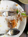 Top view of empty dirty plate. Food was eaten in a white dish on Royalty Free Stock Photo
