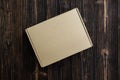 Top view of empty Package brown cardboard box or tray on wooden