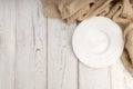 Top view of empty plate with fabric on white wooden table and copy space Royalty Free Stock Photo