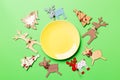 Top view of empty plate and New Year decorations on colorful background. New year serving for festive dinner. Reindeer and Royalty Free Stock Photo