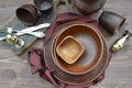 Top view of empty plates. Rustic pottery and home interior decor. Antique metal Royalty Free Stock Photo