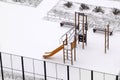 Top view of empty slide on winter Playground covered with snow Royalty Free Stock Photo