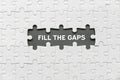 Top view of an empty space of jigsaw puzzle fill with a phrase Fill The Gaps