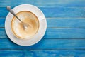 Top view empty white coffee cup (latte coffee) on blue vintage w Royalty Free Stock Photo