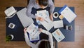 Top view of entrepreneurs woman checking management graphs paperwork Royalty Free Stock Photo