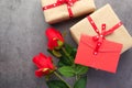 Top view envelope and rose flower on black background