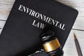 Top view of Environmental Law on black book with gavel background. Law concept Royalty Free Stock Photo