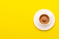 Top view espresso coffee in white cup on yellow Royalty Free Stock Photo