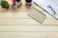 Top view eyeglasses,pen,black coffee,cactus, ,Laptop,stationary,notebook on office desk background.