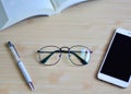 Top view Eyeglasses on wood table.